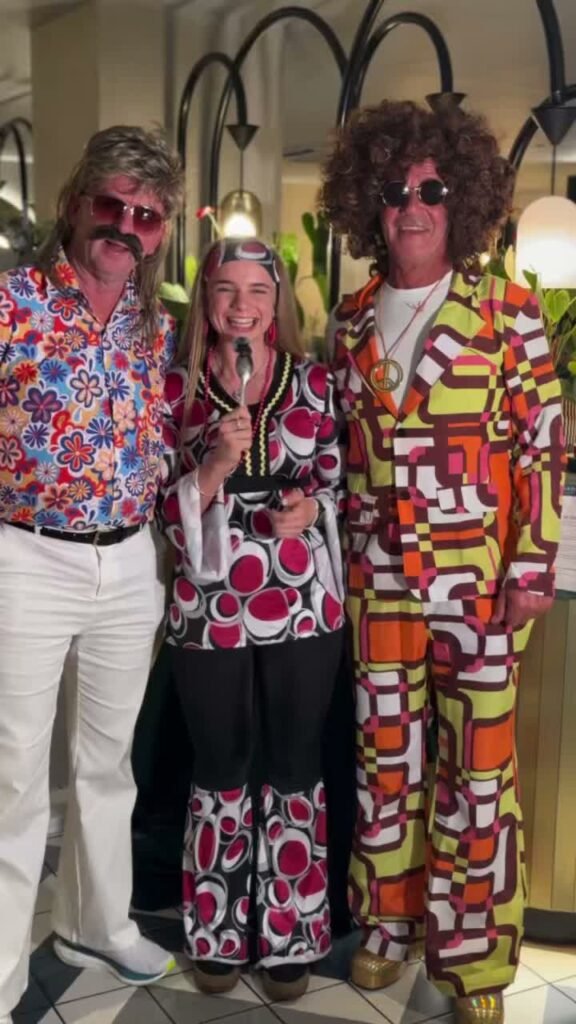 Guests in 1970s costumes at the Shish Mahal Night, Sanam Tandoori, Falkirk